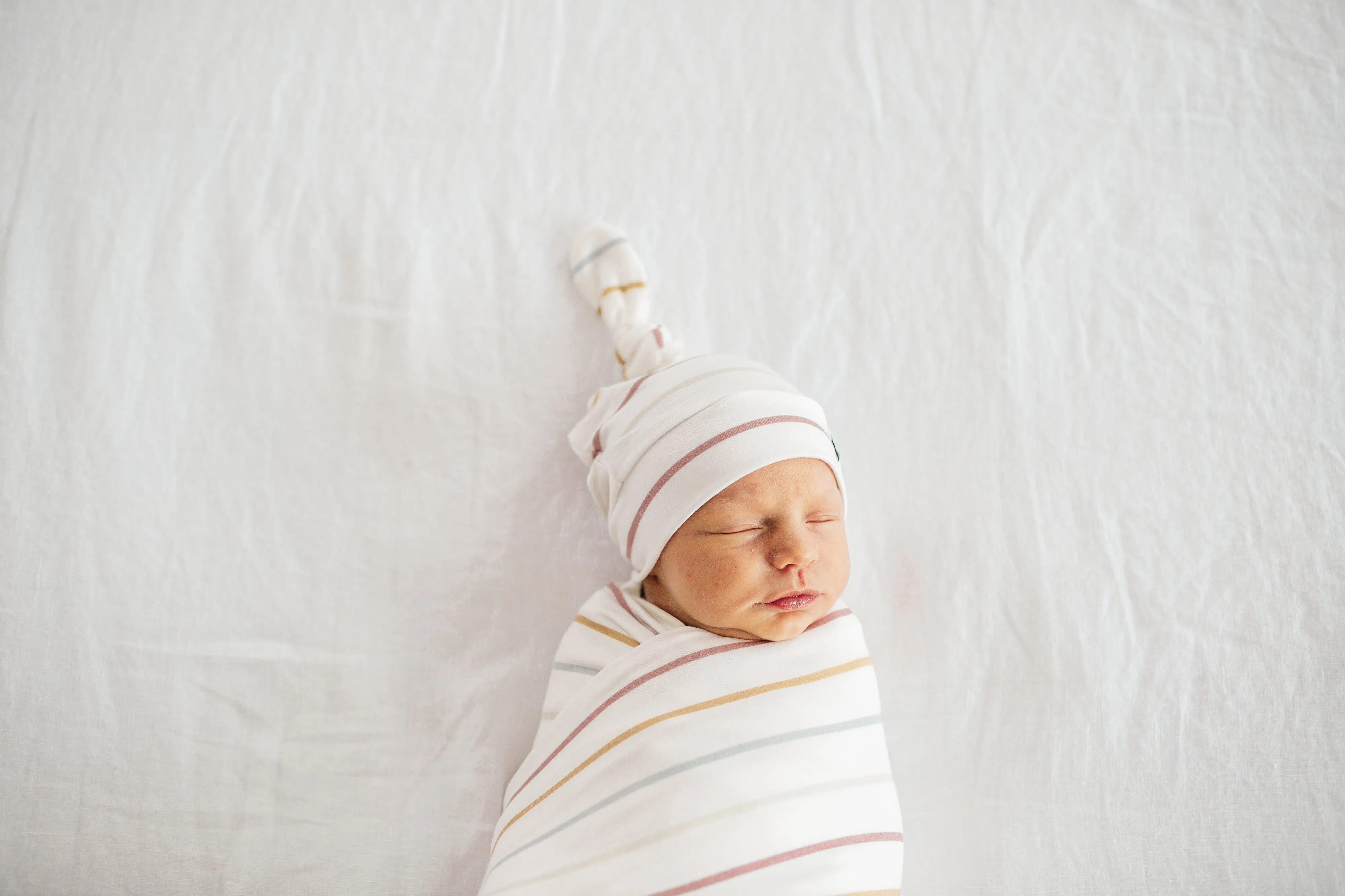 Copper Pearl Piper Top Knot Hat